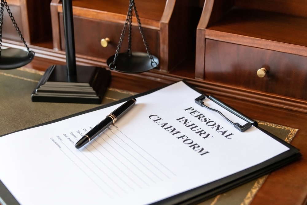 Clipboard with the text personal injury claim form