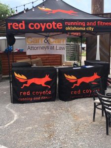 the Carr & Carr Attorneys at Law and Red Coyote Running and Fitness booth at Oklahoma City's Global Running Day Social Run.