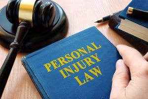 Do I Have to Go to Court for My Oklahoma Car Accident? 2 Personal injury law and gavel on a desk