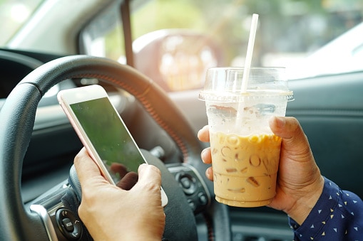 Drinking and using a cellphone while driving