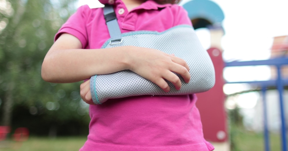 Tulsa Child Injury Lawyer 2 Child wearing an arm sling after an injury, illustrating common childhood accidents