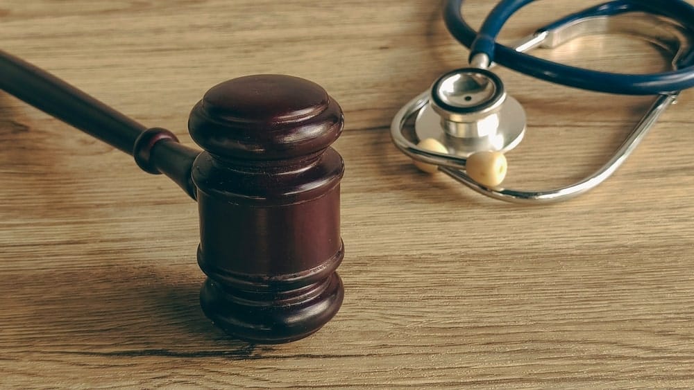 Gavel and stethoscope symbolizing the legal and medical consequences of drunk driving accidents